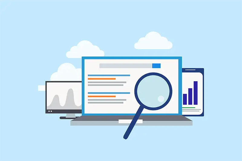 Magnifying glass over laptop with search results Magnifying glass over laptop with search results