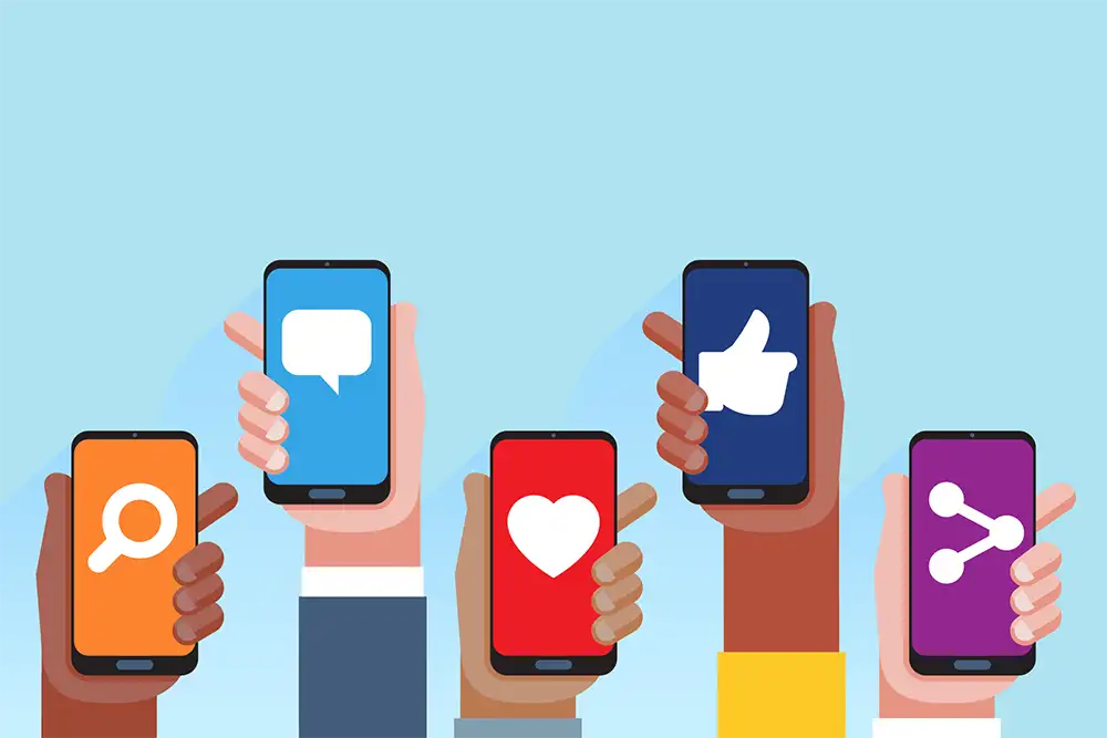 Multi skin color hands raising smartphones with social media application icons