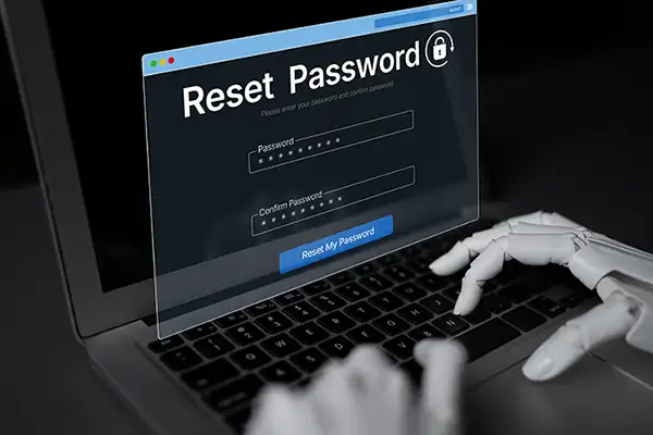 Hands typing on laptop to reset account password